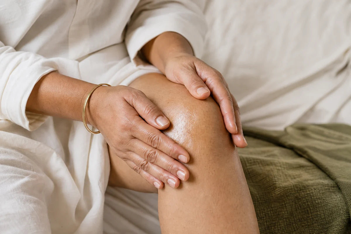 Hands gently massaging the outer knee