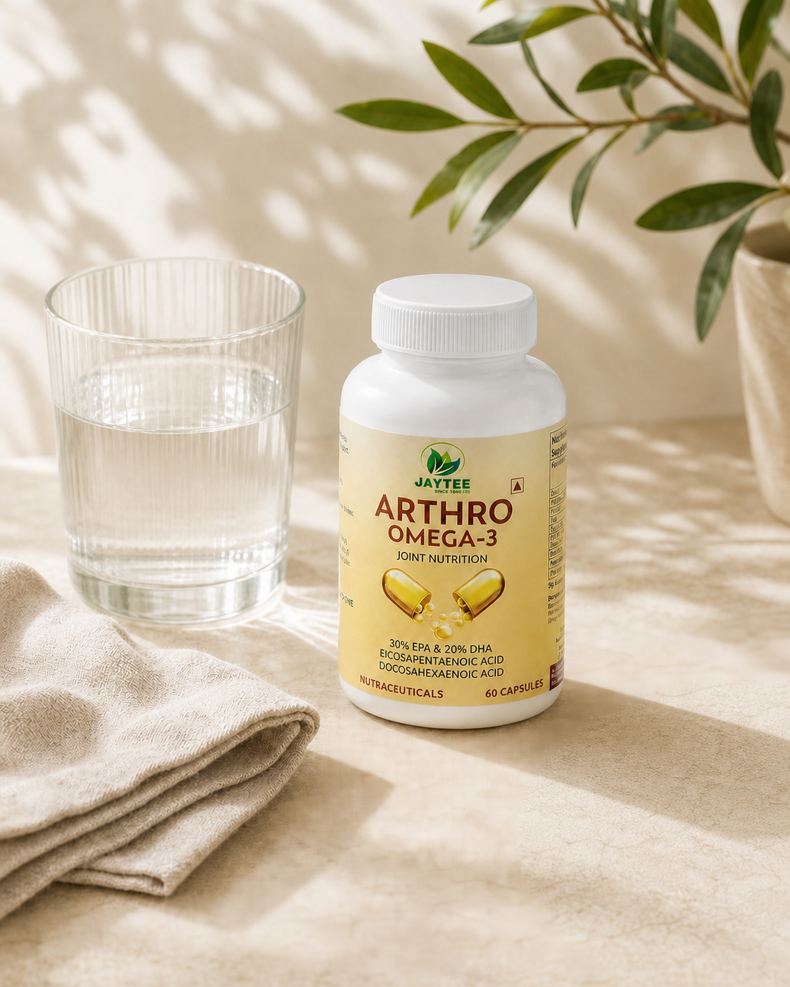 Closed Arthro Omega 3 60-capsule bottle beside water and linen in a clean daily wellness setting