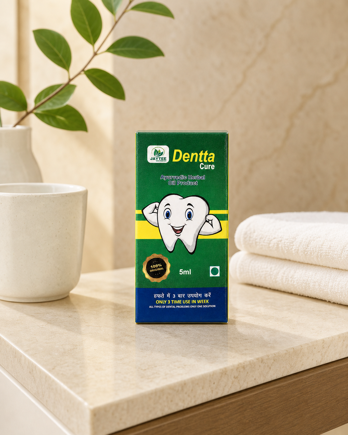 Closed Dentta Cure 5 ml box beside a cup and folded towels in a practical care setting